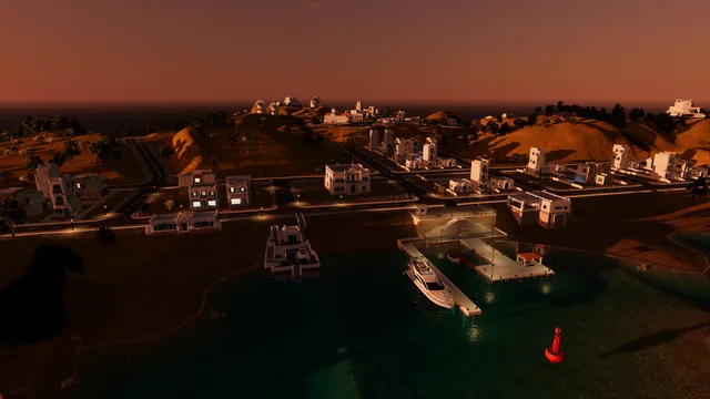 The harbour at dusk with street lamps and lit windows, the yacht at the pier and the church and windmills on the skyline